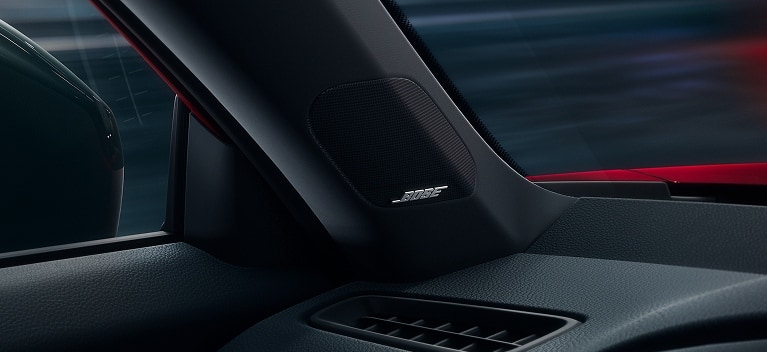 2027 Honda Civic Sedan Sport Touring Hybrid in Rallye Red Bose speaker on A-pillar interior view (Compact Sedan)